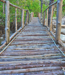 close up of long, straight bridge made of log wood