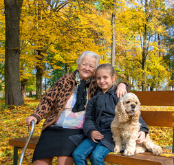 Grandmother and child sitting on the bench