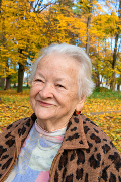 Old woman in autumn park