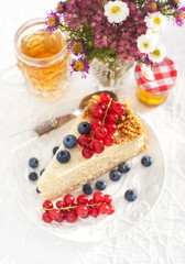 Piece of homemade honey cake with fresh berries
