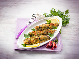 fish fillet with  hot chili pepper and parsley