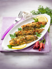 fish fillet with  hot chili pepper and parsley, selective focus