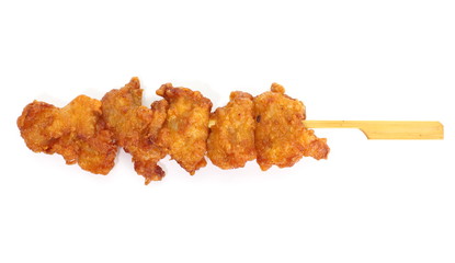 Fried chicken with skewer on white background