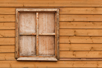 Obraz na płótnie Canvas window in wooden wall