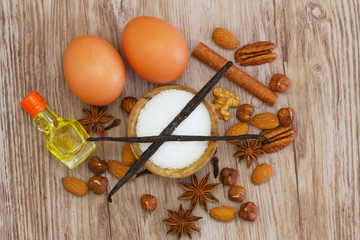 Selection of baking ingredients on wooden surface