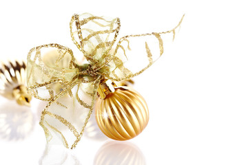 New Year's gold ball with a bow.