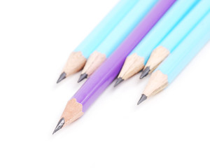 Blue pencils and one purple standing out.