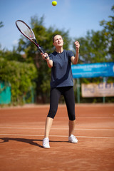 Tennis player executing a forehand volley