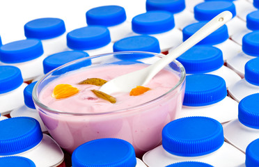 Numbers of yogurt bottles And a glass bowl with yogurt.