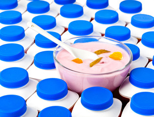 Numbers of yogurt bottles And a glass bowl with yogurt