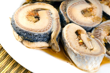 Rolls from a herring on a plate