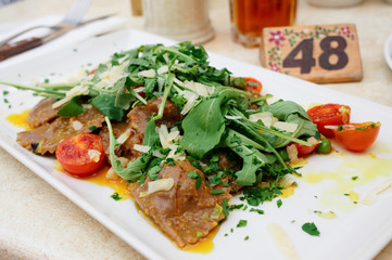 Rabbit ravioli with rocket salad
