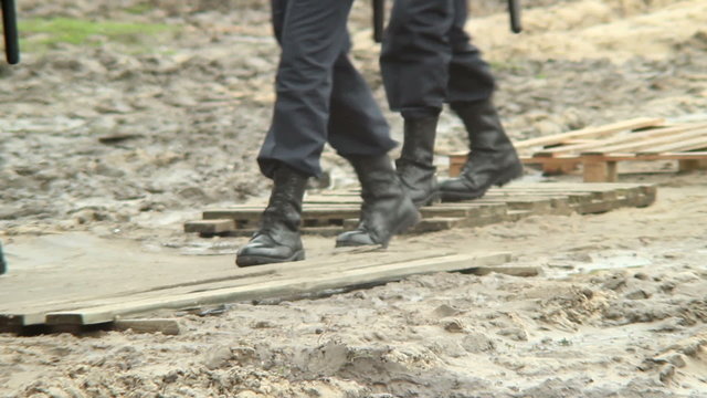 Military forces boots step over dirt, rescue emergency situation