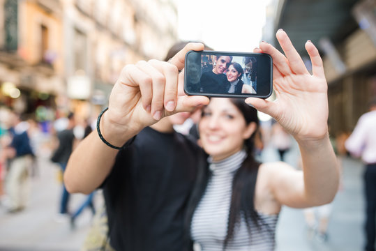 Two young couple taking an autophoto