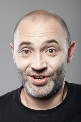 amazed man portrait isolated on gray background
