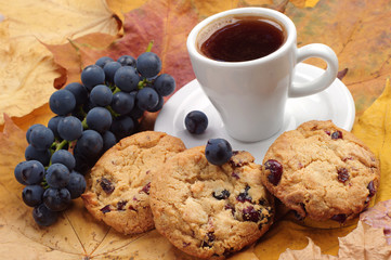 Cup of coffee, cookies and grape