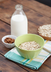 Bowl of oatmeal with almonds and milk