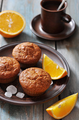Fototapeta na wymiar Carrot muffins with fresh oranges
