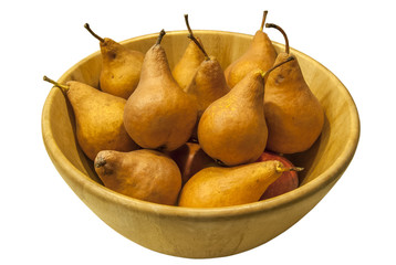 Winter organic pears in wooden bowl isolated on white background