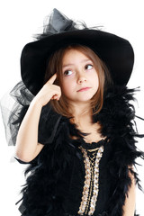 beautiful cute little girl in witch halloween costume hold the b