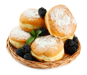 Tasty donuts with berries, isolated on white