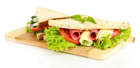 Tasty sandwiches with salami sausage and vegetables
