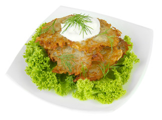 Potato pancakes on plate, isolated on white