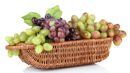 Fresh grape in wicker basket, isolated on white