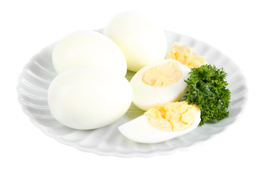 Boiled eggs on plate isolated on white