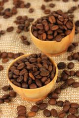 Coffee beans in bowls on table close-up