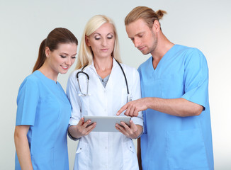 Medical workers on grey background