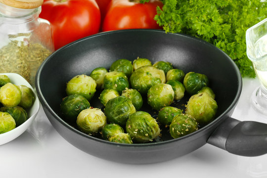 Fresh brussels sprouts in pan with vegetables and spices