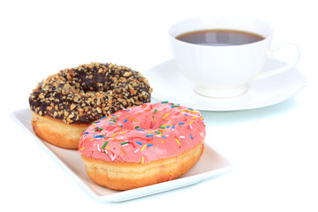 Sweet donuts with cup of tea isolated on white