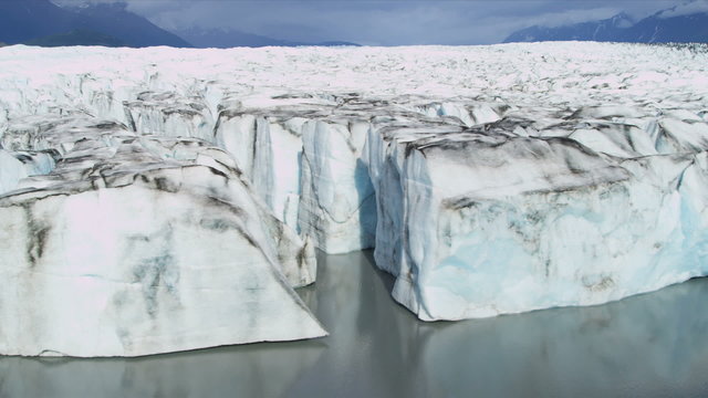 Aerial view of moraine covered Ice Glacier, Alaska, Arctic Region, USA