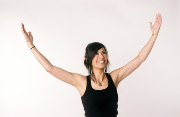 Pretty Brunette Woman Holds Arms Outstretched Jubilant Look Up