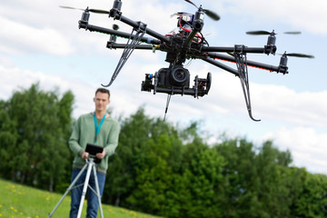 Technician Operating UAV Octocopter