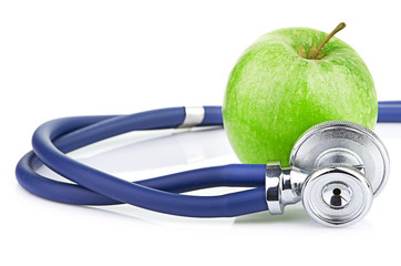 Medical stethoscope and apple isolated on white