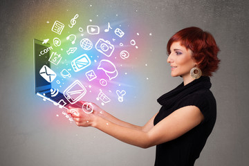 Young lady holding notebook with colorful hand drawn multimedia