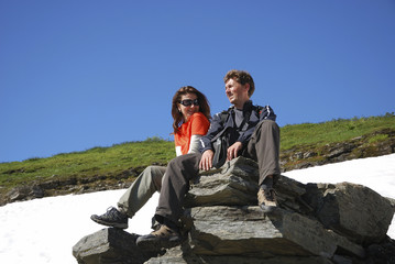Couple of tourists in mountains