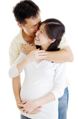 Asian man kiss his pregnant wife