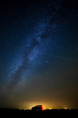 The car of the tourist against the star sky.