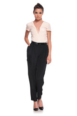 Fototapeta premium woman standing with hand in pocket