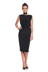 Fototapeta premium female fashion model in black dress and high heels shoes