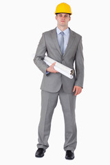 Architect with plans wearing helm