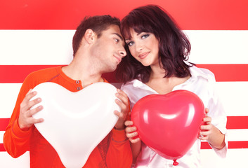 Fototapeta na wymiar Charming love couple with heart-shaped balloon