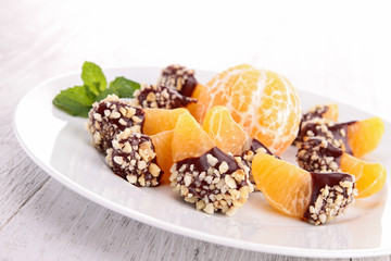 slice of tangerine with chocolate