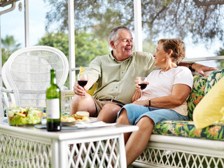 senior couple outside on patio relaxing