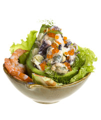 Seafood salad with red caviar in avocado