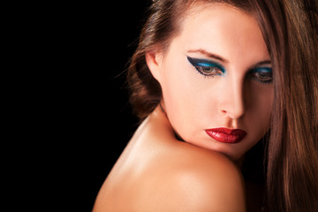 Sensual woman with professional makeup on black background