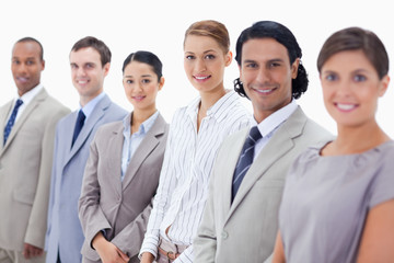 Close-up of smiling business people looking straight